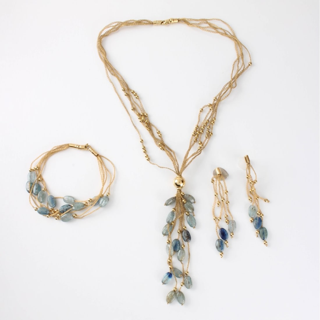Aquamarine and 18K Jewelry Suite: Vintage Italian Tumbled Cabochon Aquamarine Bead and 18 Karat Yellow Gold Multi-strand Tassel Necklace, Bracelet and Earrings Suite. Stamped 750. Necklace measures 18" L plus 4" tassel drop; bracelet 