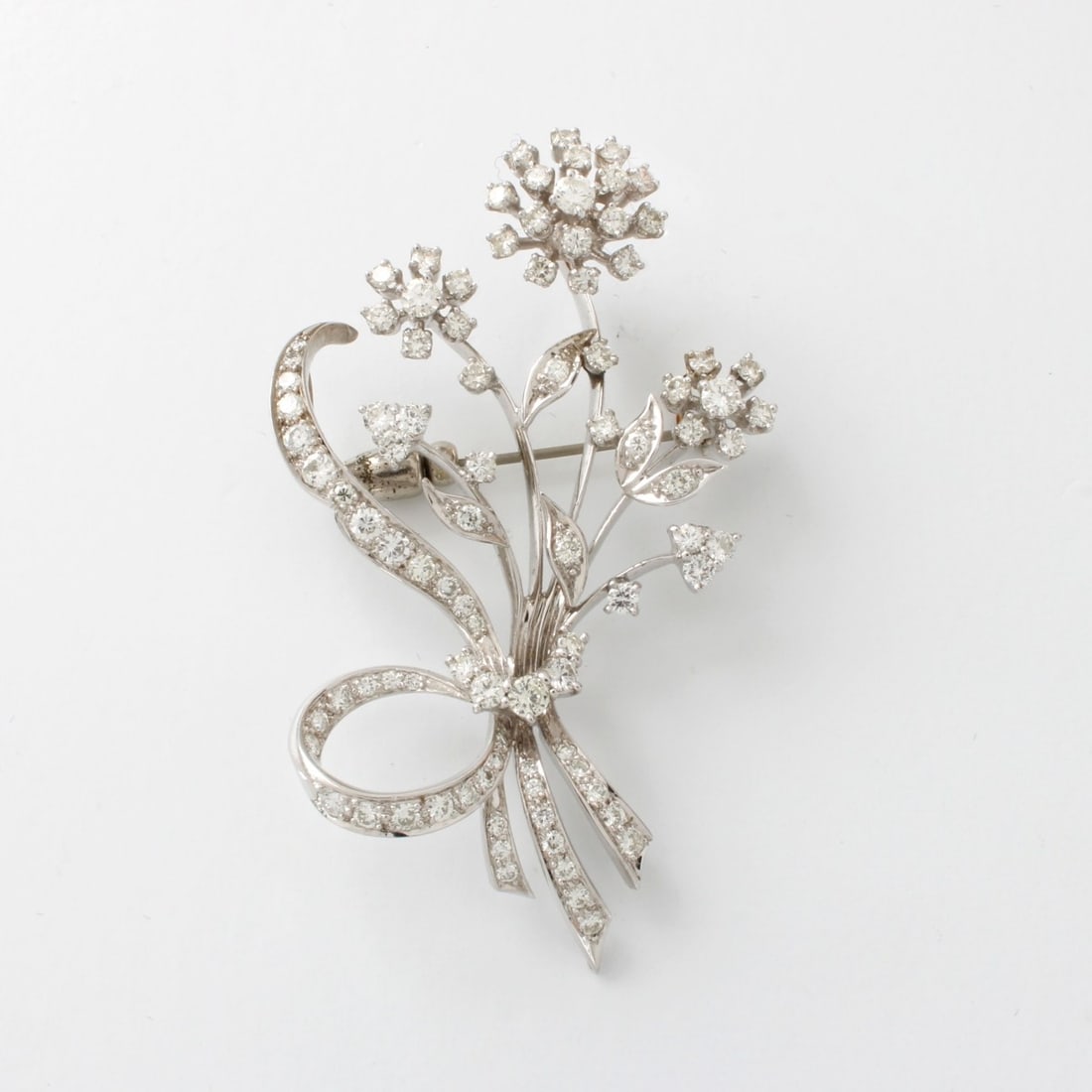 Diamond and 14K Pendant / Brooch: Vintage Approx. 4.0-4.5 Carat TW Round Brilliant Cut Diamond and 14 Karat White Gold Spray Pendant / Brooch. Diamonds F-G color, VS1-VS2 clarity. Measures 2-3/8" H, 1-1/2" W. Approx. weight: 14.47