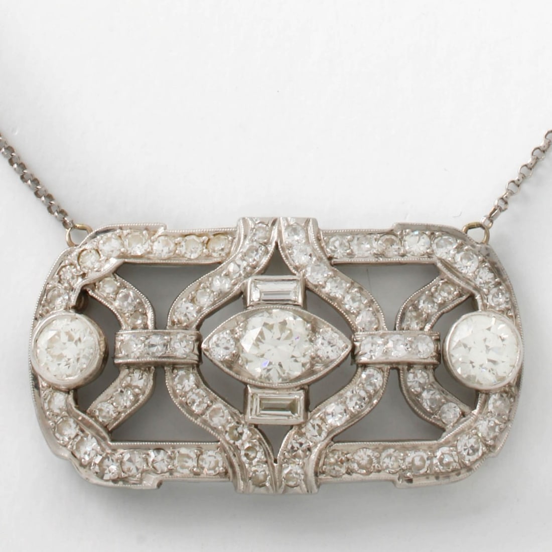 Deco Diamond and Platinum Pendant: Art Deco Approx. 6.36 Carat TW Diamond and Platinum Pendant with 14 Karat White Gold Chain. Set with approx. 1.76 carat TW three old European cut diamonds weighing .66, .56 and .54 carat each.