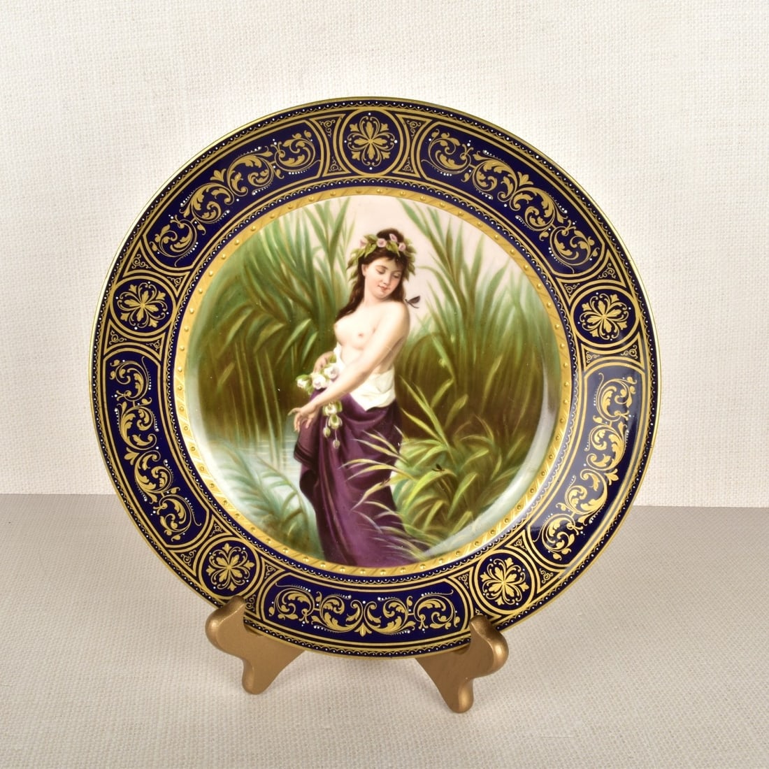 Royal Vienna Portrait Plate: Royal Vienna Portrait Plate Standing Semi-Nude Woman, Cobalt Blue and Gilt Hand Painted Portrait Plate. Signed H. Herr. Marked on the back with the Royal Vienna beehive mark under glaze. Circa