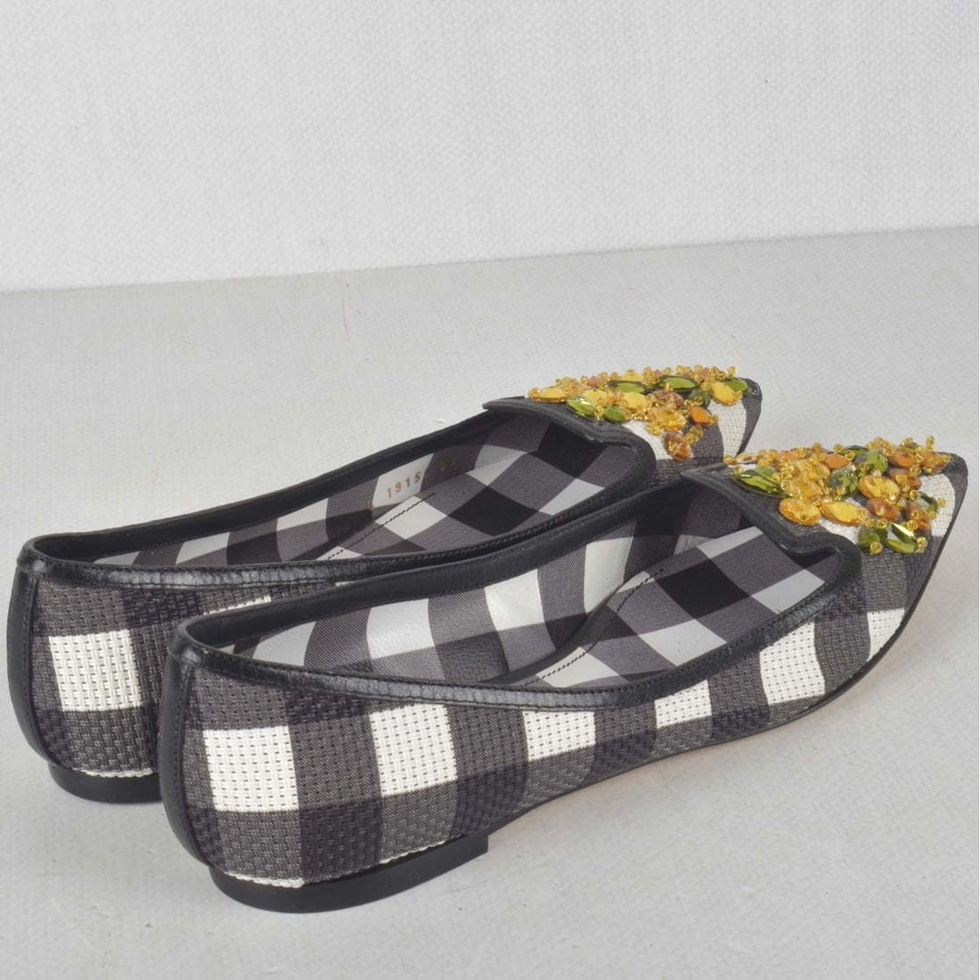 Womens Dolce & Gabbana Shoes: Womens Dolce & Gabbana Plaid Flats with Crystals. Serial number C 19155. Eur. size: 38. Kodner Galleries offers phone and absentee bidding at a low, flat 21% buyer’s premium without surcharge or