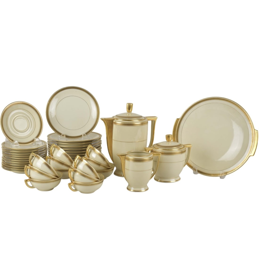 Limoges France Gouzon Porcelain: Thirty-nine (39) Pieces Limoges Gouzon France Porcelain Desert Service with a Greek Key Design on a Cream Ground. All properly marked to the bottoms. Consisting of one (1) round cake stand, measures: