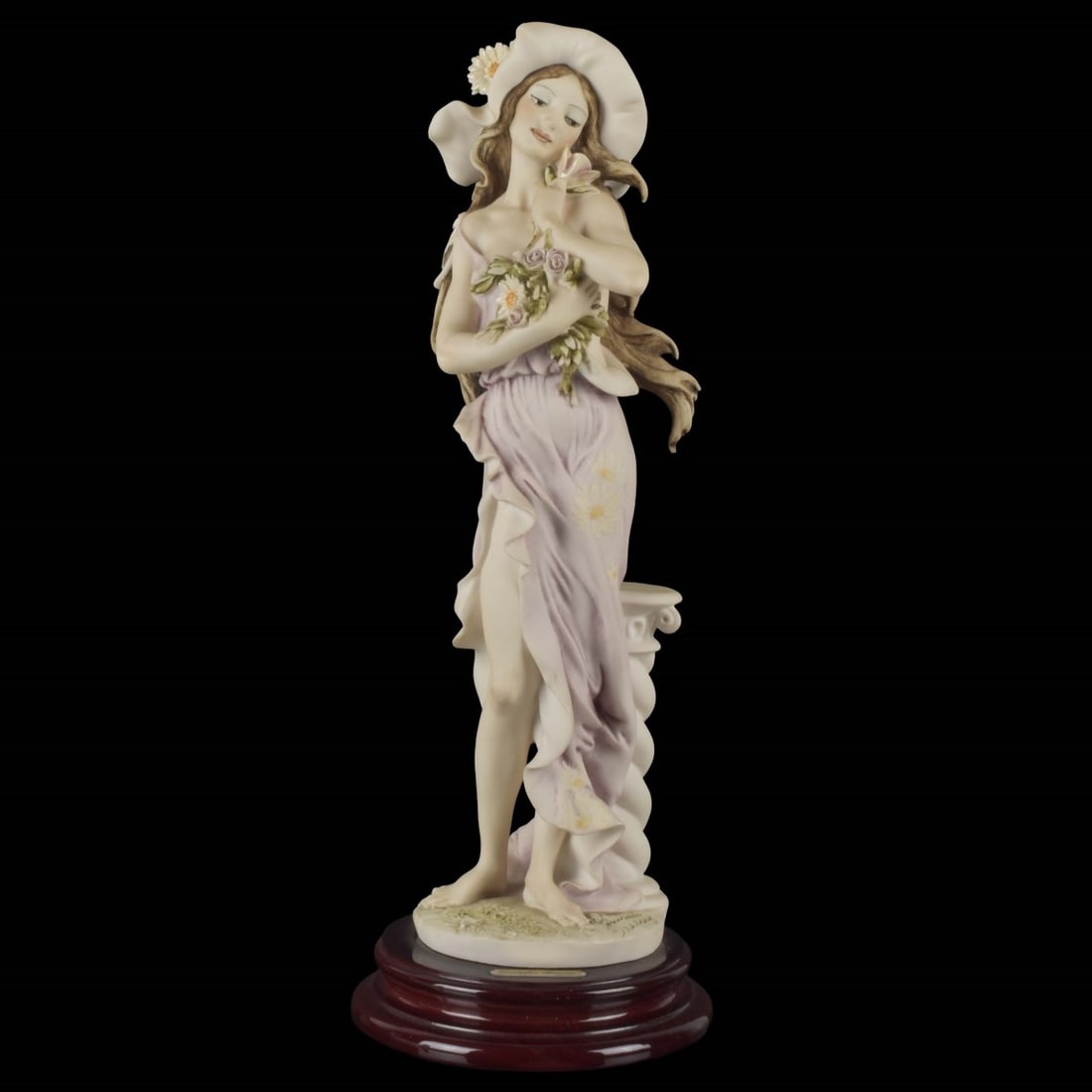Giuseppi Armani "Daisy": Giuseppe Armani Figurine: 1994 Event Piece "Daisy" With Original Box. Artist signed. Figurine measures: 13-3/4" high, 4" wide, 3-1/2" deep. Kodner Galleries offers phone and absentee bidding at a