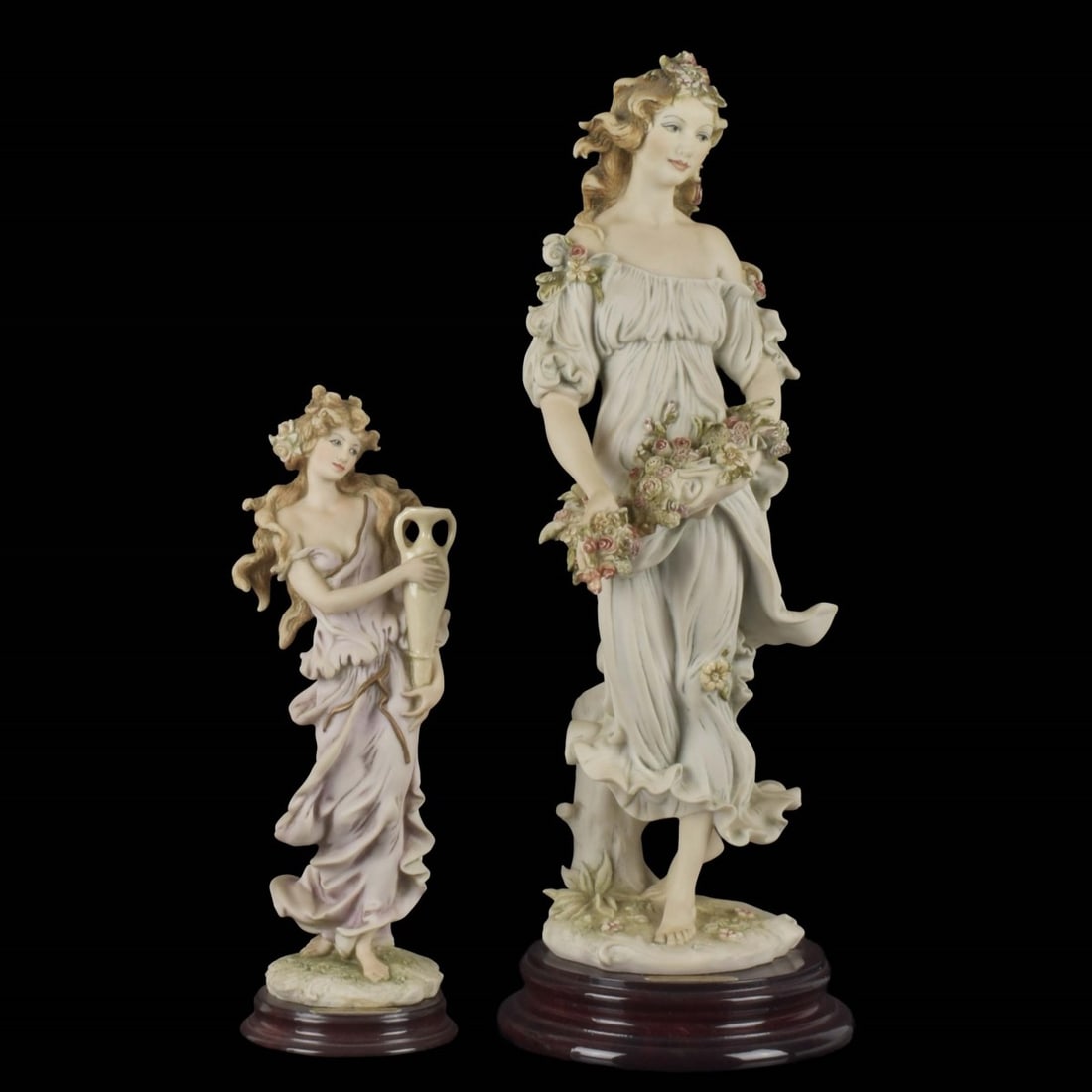 Giuseppe Armani Figurines: Two (2) Giuseppe Armani Figurines. One (1) "Flora" Collector Society 1994, figure measures: 13-1/2" high, 5" wide, 5" deep, one (1) "Aquarius" 1995 figure, measures: 9-1/4" high, 3" wide, 2-3/4"