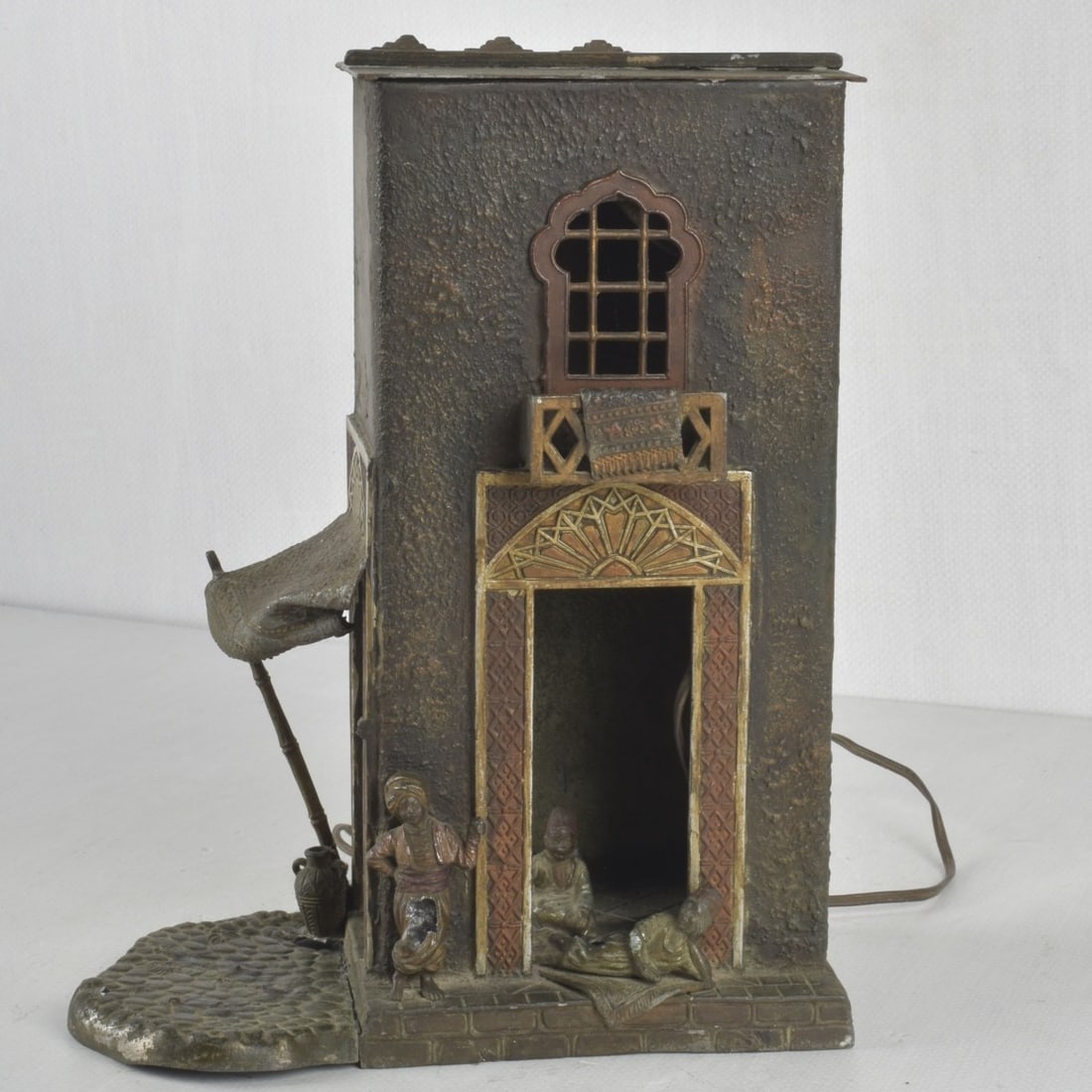 Style of Franz Xaver Bergmann, Austrian (1861-1936: Style of Franz Xaver Bergmann, Austrian (1861-1936) Antique Cold-Painted White Metal Table Lamp. Modeled as a group of Arab carpet sellers. Measures: 12-1/2" high, base measures: 9-1/4" wide, 4-3/4"