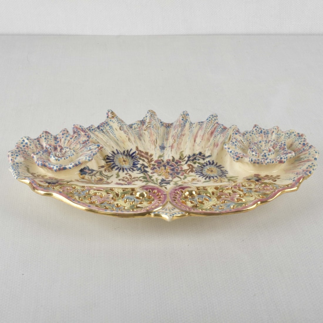 J. Fischer Budapest Hungarian Plate: J. Fischer Budapest Hungarian Hand Painted Porcelain Plate. Decorated with a shell at each end in high relief and a reticulated side. Properly marked to the bottom. Measures: 1-1/2" high, 13-1/4" long