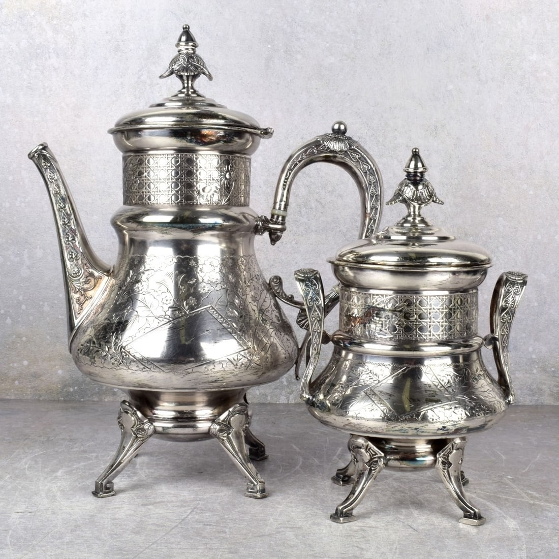 Antique Silverplate Rogers & Brother Pieces: Two (2) Pieces Antique Silverplate Rogers & Brother Triple Plate Coffeepot and Covered Sugar Engraved with Flowers and Leaves. Properly marked to the bottom. Coffee pot measures: 12-1/2" high, 9-1/2" 