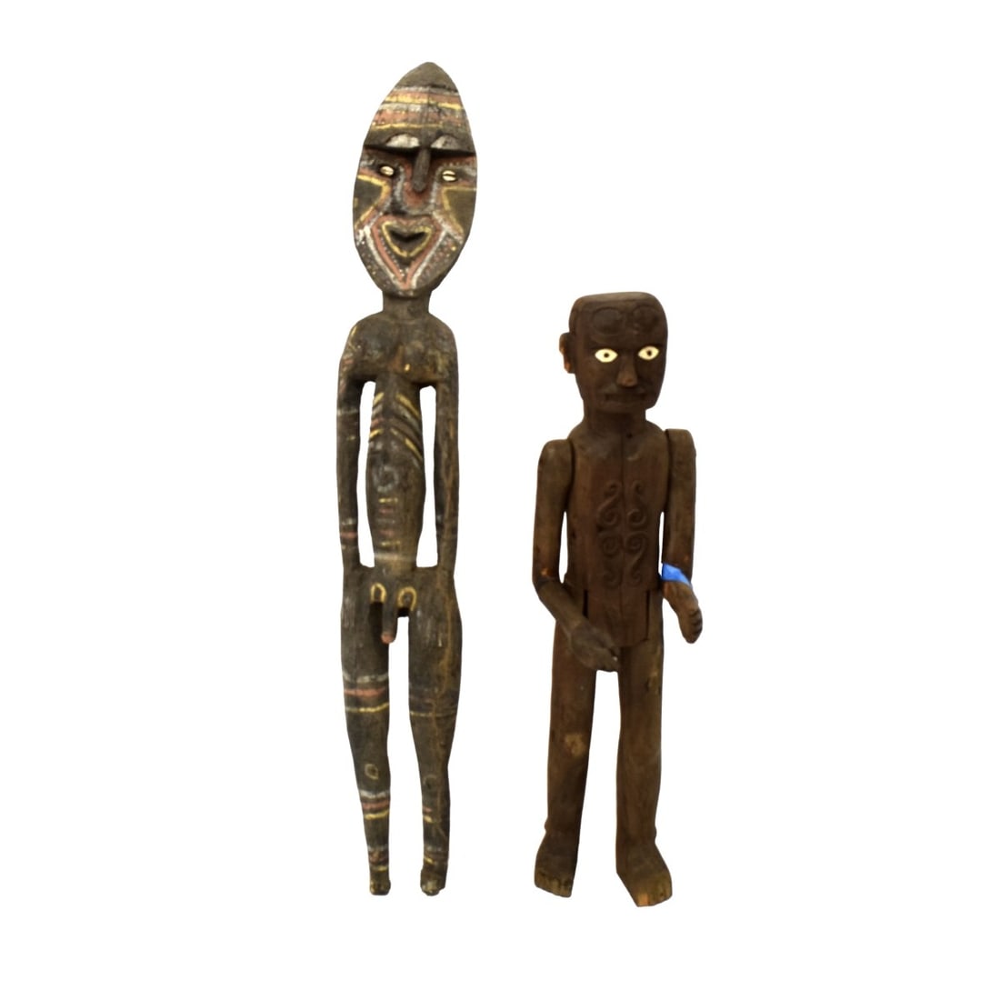 Large Vintage Carved African Tribal Figures: Two (2) Large Vintage Carved African Tribal Figures. Largest measures: 26" H., 6" W., 5-1/2" D. Kodner Galleries offers phone and absentee bidding at a low, flat 21% buyer’s premium without