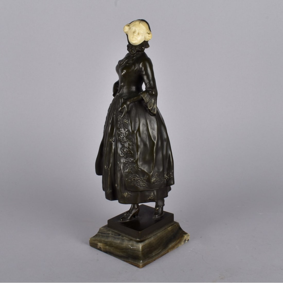 Ferdinand Lugerth, Austrian (1885 - 1915): Ferdinand Lugerth, Austrian (1885 - 1915) Bronze Sculpture with Carved Face "Girl with Book" Signed and Marked AR on the Reverse Side. Presented on a Marble Base. Overall measures 12-1/4" x 3-3/4" x