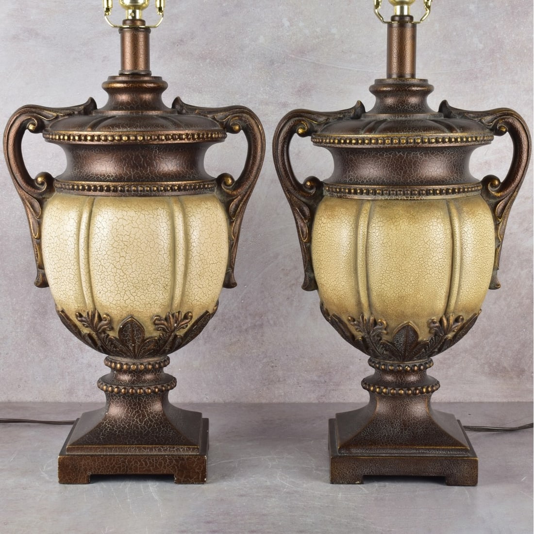 Neo-classical Style Urn Lamps: Pair of Neo-classical Style Pottery Urn Table Lamps. Urn portions measure: 17-1/2" wide, end of handle to end of handle measures: 11" wide, 7" deep. Kodner Galleries offers phone and absentee bidding