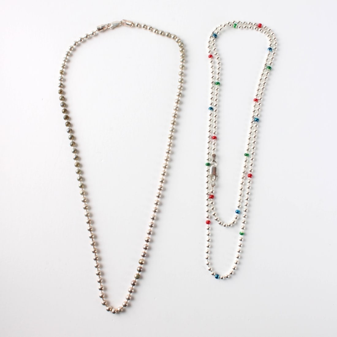 Italian Sterling Chains: Two Vintage Italian Sterling Silver Ball Link Chain Necklaces. One with enamel accents. Stamped Italy 925. Longer measures 30" L, shorter measures 20" L. Approx. total weight: 42.66 grams. Kodner