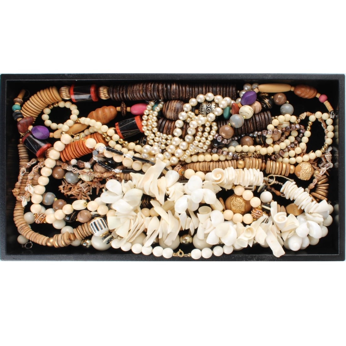 Tray Lot of Fashion Necklaces: Tray Lot of Vintage Fashion Necklaces. Variously accented with shell, horn, wood, faux pearls, hardstones and more. Various makers and styles. Kodner Galleries offers phone and absentee bidding at a