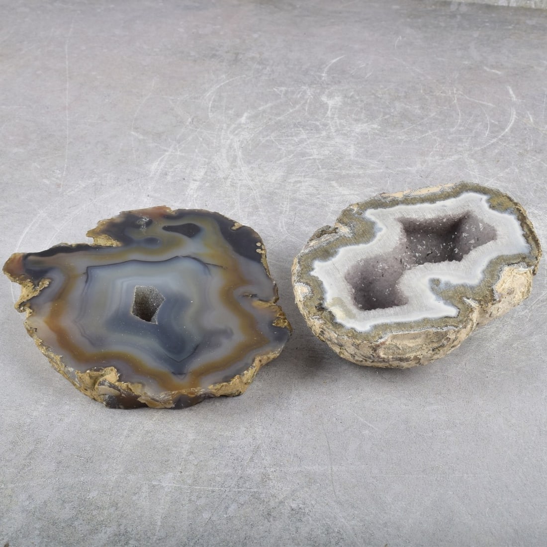 Natural Geodes: Two (2) Natural Geodes. One (1) agate geode paperweight, measures: 2-1/4" high, 5" wide, 4" deep, one (1) polished geode slice, measures: 3/4" high, 6-1/4" wide, 5" deep. From an important Palm