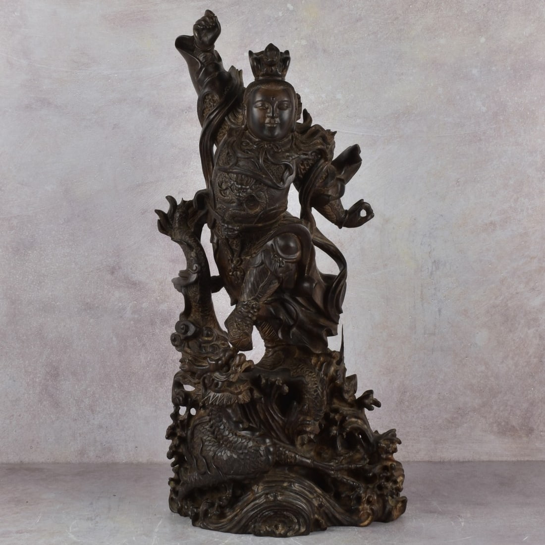 Chinese Wood Sculpture of a Warrior: Well Carved Chinese Wood Sculpture of the Warrior Guan Yin Traditional Warriors Armor Slaying a Dragon With Swirling Water to the Ground. Late 20th century. Measures: 24" high, 11" wide, 5-1/2" deep. 