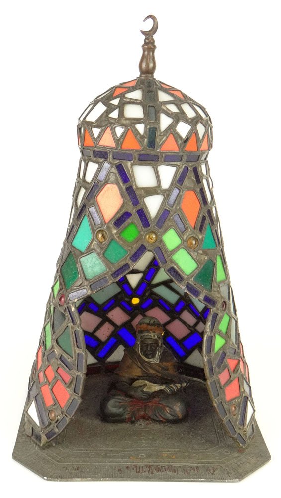Austrian Vienna White Metal and Leaded Glass Lamp: Austrian Vienna White Metal and Leaded Glass Lamp Sculpture with Arab Man Sitting on a Persian Carpet Inside of a Tent with Mosque Figure Above Playing Guitarlike Instrument. Circa 1960's. Unsigned. G