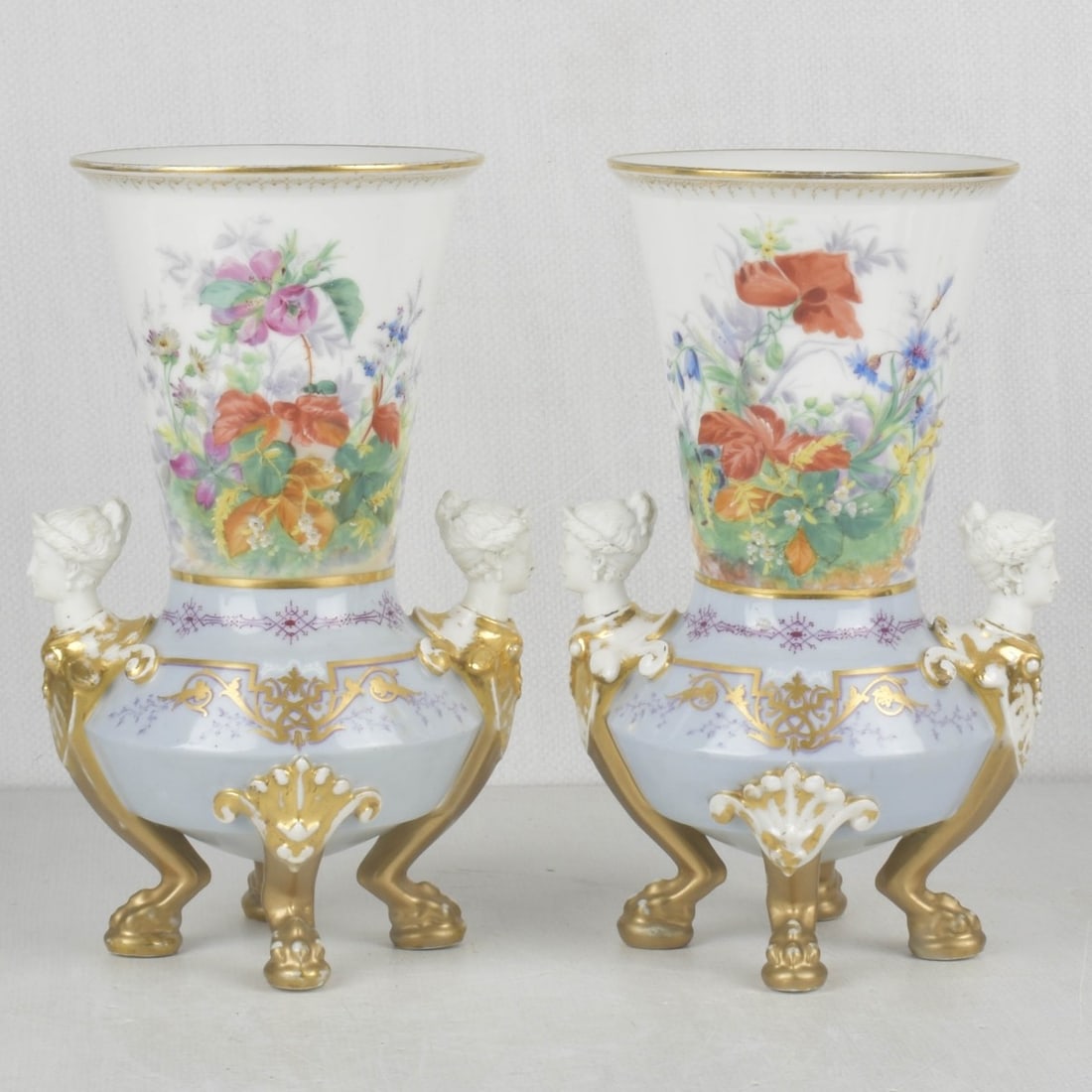 19/20th Century Old Paris Porcelain Vases: 19th/20th Century Old Paris Porcelain Vases with a Floral Motif and Having Attached Gold Gilt Neo-classical Masks to Sides Supported on Four (4) Paw Feet. Measures: 10-1/2" high, 6-1/2" wide, 5" deep.