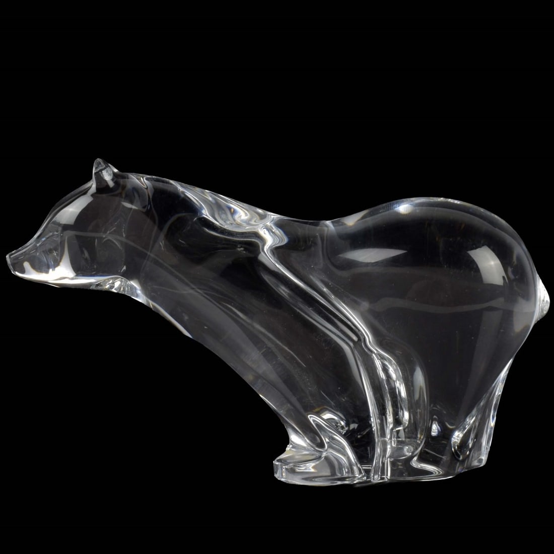 Baccarat Crystal Polar Bear Figurine: Baccarat Crystal Polar Bear Figurine. Properly marked to the underside. Measures: 4-1/8" high, 7-1/4" long, 2-3/8" wide. Kodner Galleries offers phone and absentee bidding at a low, flat 21% buyer?s