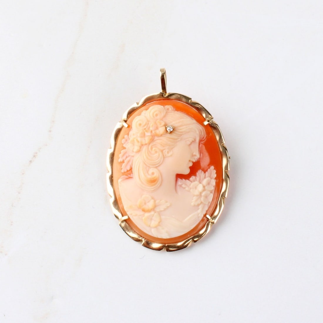 Shell and 14K Cameo Pendant / Brooch: Vintage Italian Carved Shell and 14 Karat Yellow Gold Cameo Pendant / Brooch with Small Diamond Accent. Stamped 585, Italian hallmark. Measures 1-1/2" H, 1-1/8" W. Approx. weight: 8.33 grams. Kodner