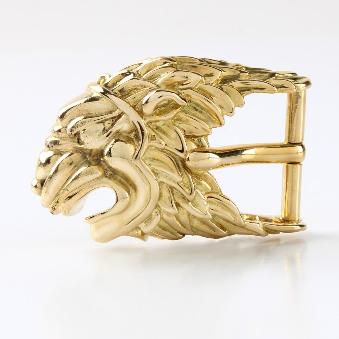 David Webb 18K Belt Buckle: Vintage David Webb 18 Karat Yellow Gold Figural Lion Head Belt Buckle. Signed, stamped 18K. Measures 10-3/8: H, 2-1/8" W. Approx. weight: 43.84 grams. Condition: Very good condition. For additional