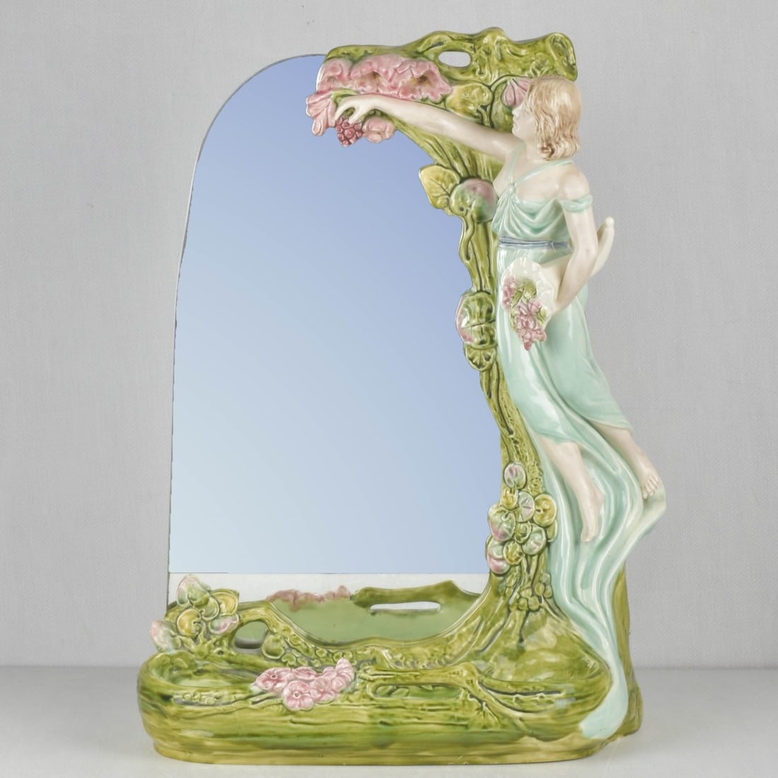 Vintage Art Nouveau Style Mirror: Vintage Art Nouveau Style Figural Porcelain Vanity Mirror and Tray Decorated with Large Flowering Tree and a Semi-nude Woman Holding a Cornucopia of Fruit. Makers mark to the inside bottom. Measures: