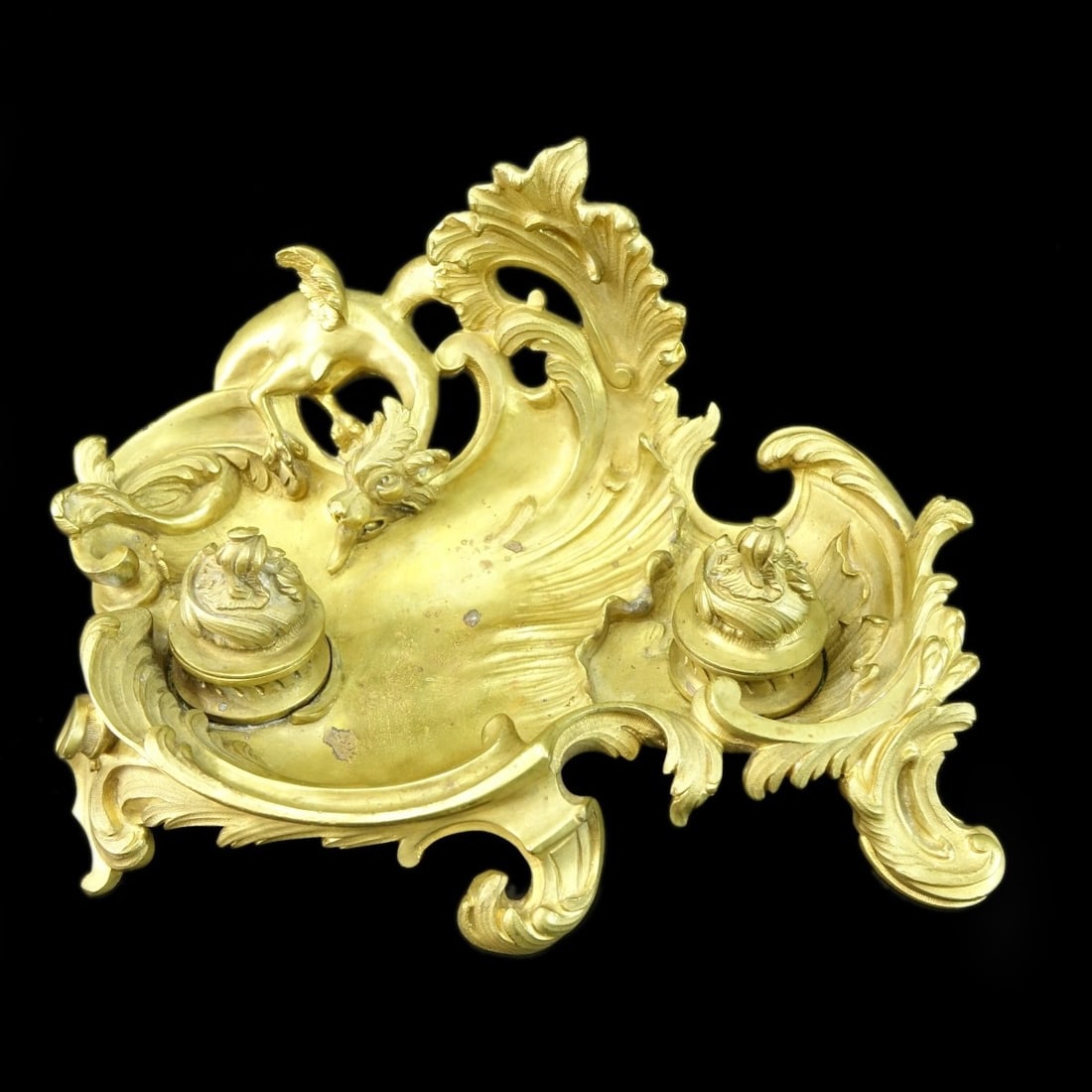 Antique Bronze Ink Well: Antique Bronze Ink Well, two hinged lids with winged dragon arising out of a bronze ocean. unsigned. Measures 6" H x 11-1/2" W x 8" deep. Kodner Galleries offers phone and absentee bidding at a low,
