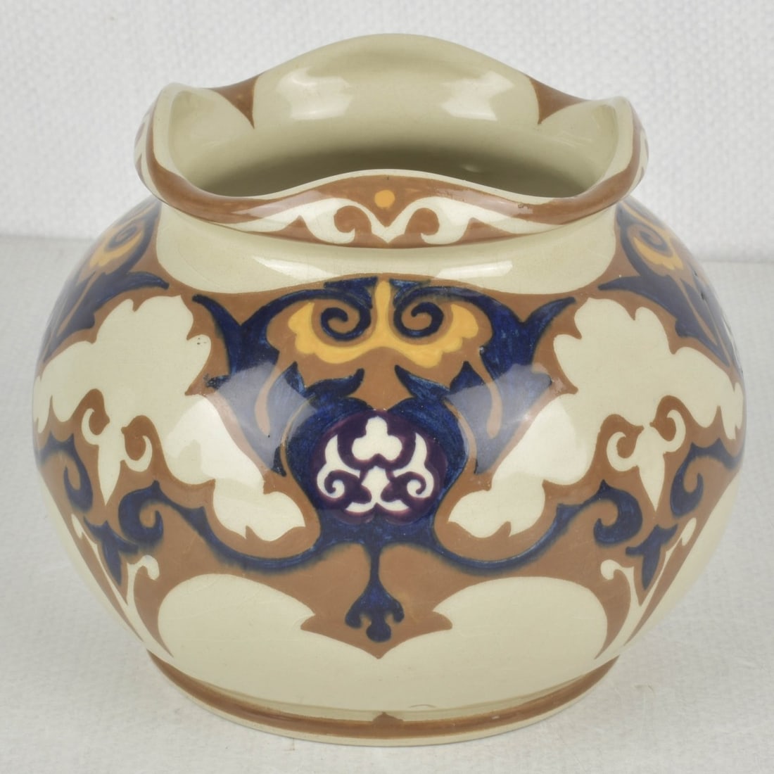 Art Nouveau Rozenburg den Haag Vase: Art Nouveau Rozenburg den Haag Dutch Glazed Pottery Squat Vase with Ruffled Top. Circa 1900. Artist signed and numbered to the bottom. Measures: 4-1/4" high, 5" diameter. Kodner Galleries offers