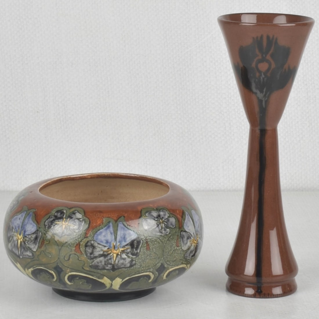 Art Nouveau Rozenburg den Haag Pieces: Art Nouveau Two (2) Rozenburg den Haag Dutch Glazed Pottery Pieces. Circa 1900. Both Artist signed and numbered to the bottoms. One (1) chalice shape vessel. Measures: 6-3/4" high, 2-1/4" diameter,