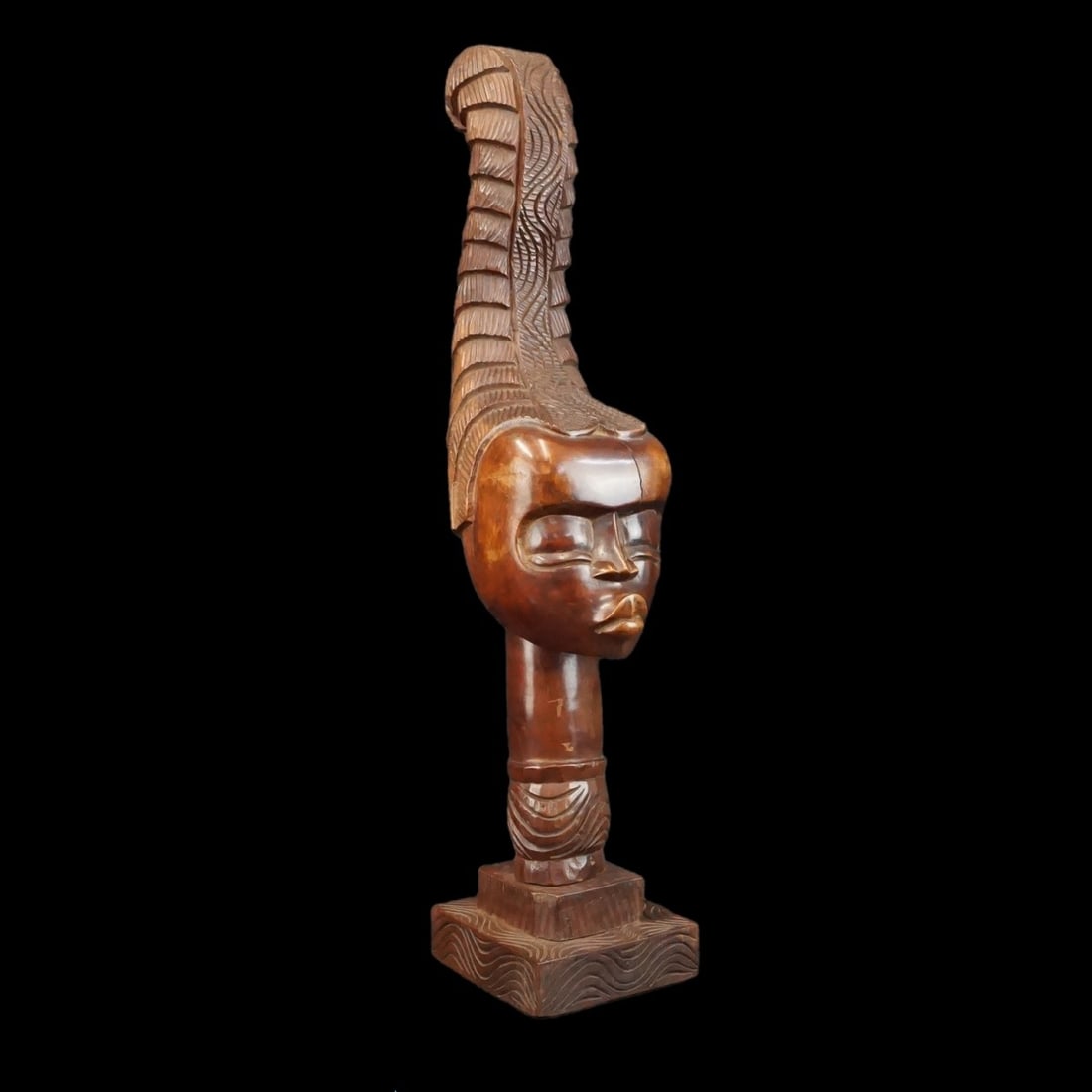 African Hand carved Woman Bust: Large African Hand Carved Wooden Bust of a Woman. Measures 32-3/4" x 6-3/4" x 6-3/4". Kodner Galleries offers phone and absentee bidding at a low, flat 21% buyer?s premium without surcharge or hidden