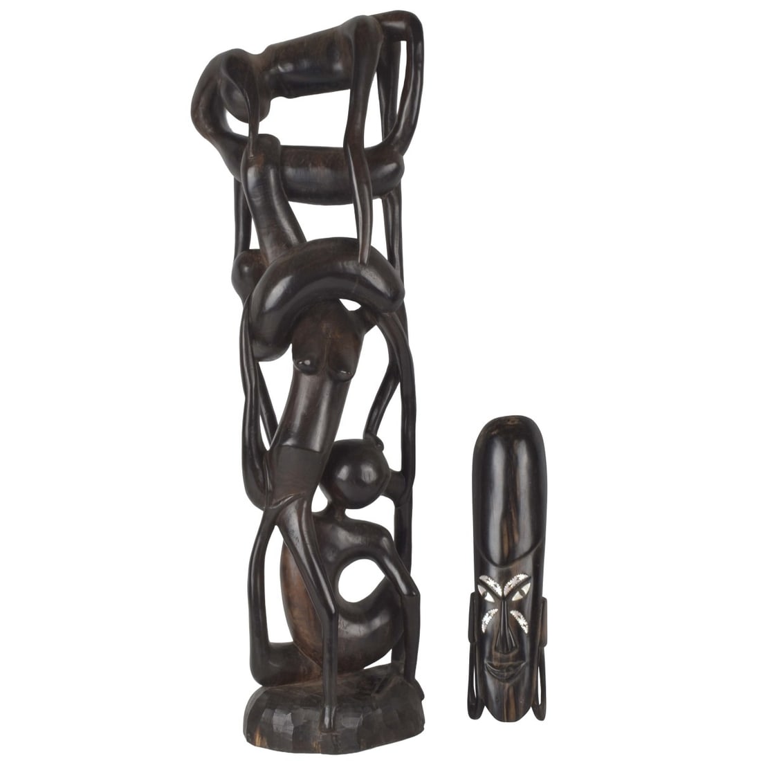 Vintage African Tribal Art Wood Sculptures: Two (2) Vintage African Tribal Art Ebony Wood Sculptures. One mask with mother of pearl insets, one with with a "Family Tree" . Tallest measures: 26-1/2 high, shortest measures: 11-1/2" high. Kodner