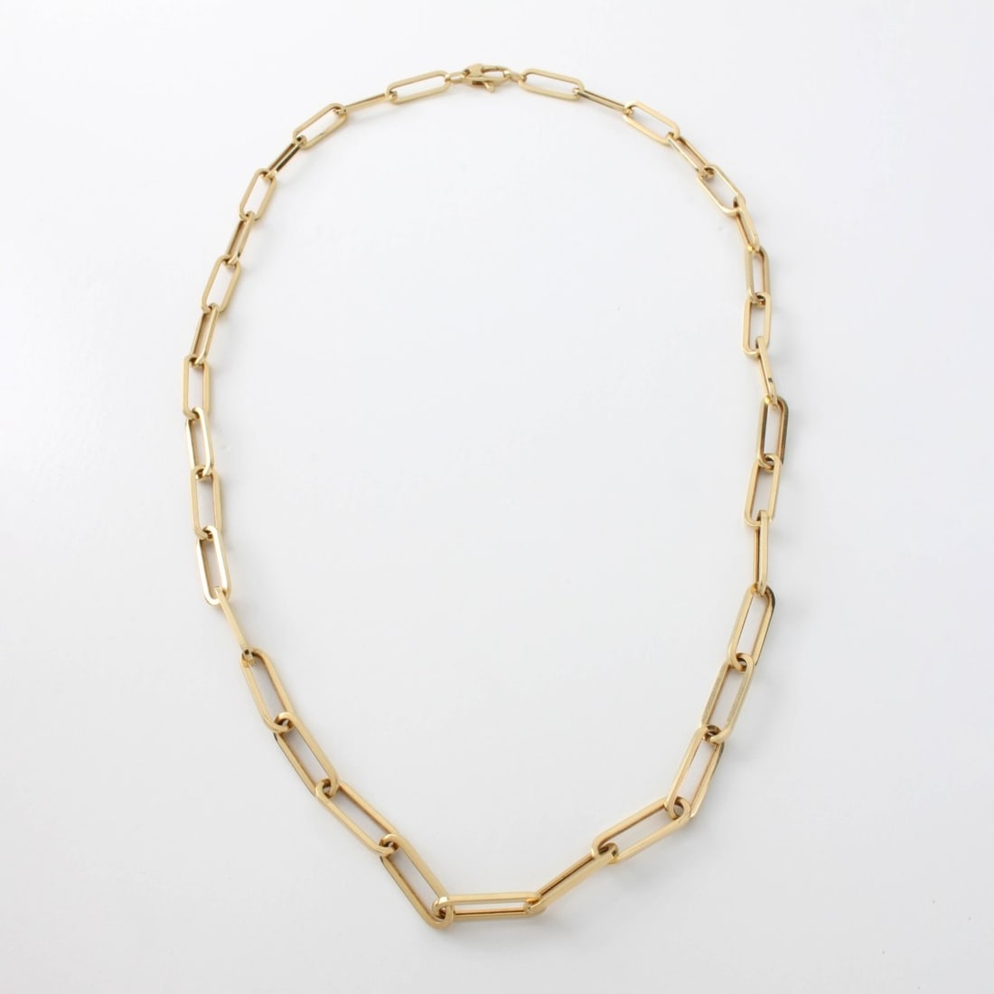 14K Link Chain Necklace: 14 Karat Yellow Gold Elongated Oval Link Chain Necklace. Measures 18-1/2" L. Links measure 5/8" L. Approx. weight: 7.22 grams. Kodner Galleries offers phone and absentee bidding at a low, flat 21% buy