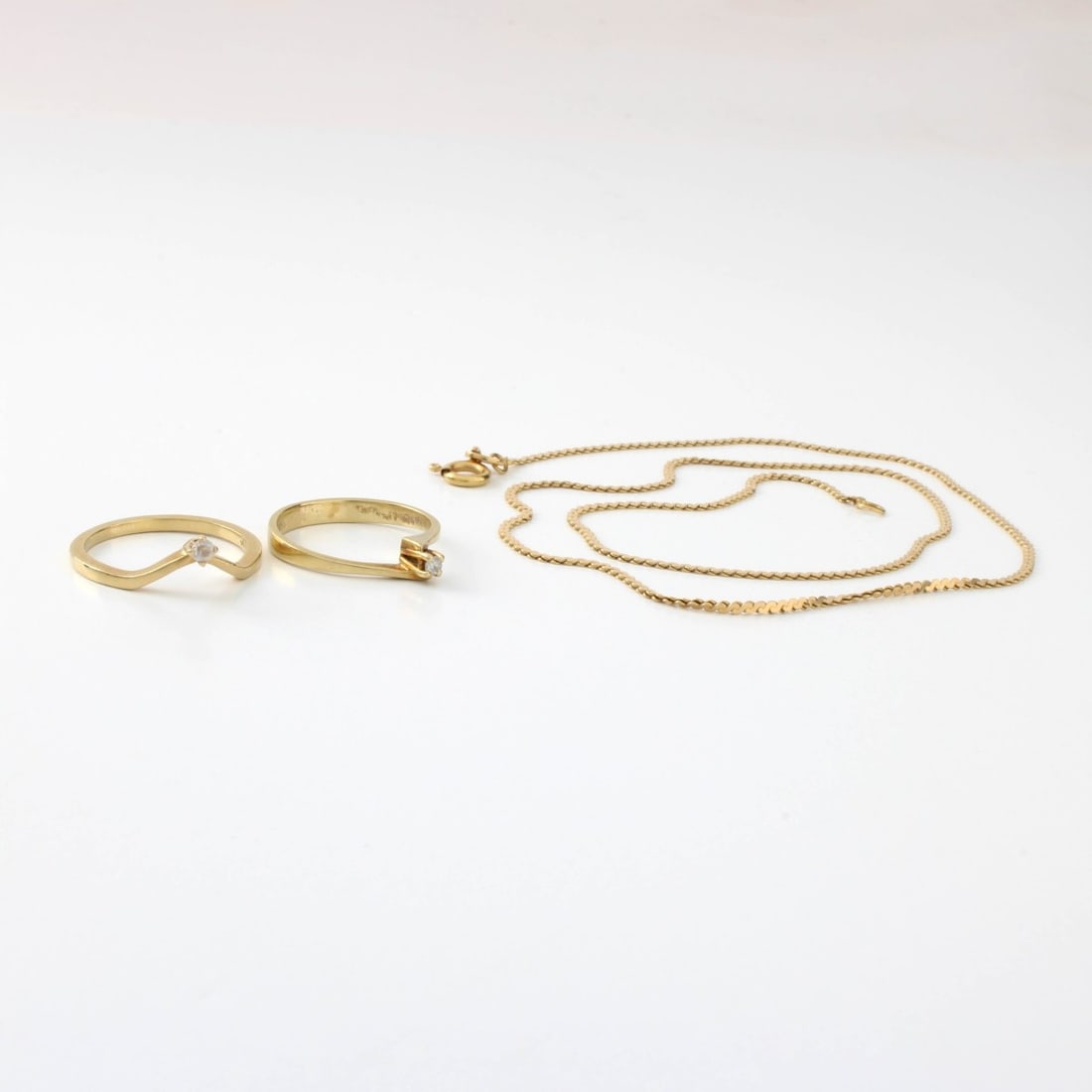 Gold Rings and Necklace: Two Vintage Delicate 14 Karat Yellow Gold Rings with Small Diamonds and a Delicate Italian 18 Karat Yellow Gold Link Chain Necklace. Ring stamped 14K, necklace clasp stamped 18K, Italy. Rings size 5, 