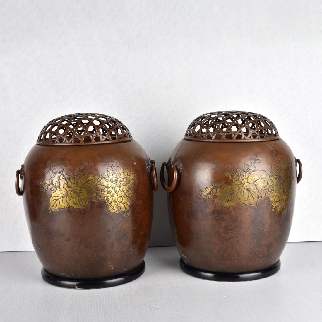 Japanese Hand Warmers: Pair of Antique Japanese in the Style of Nakagawa Joeki Bronze Hand Warmers with Wooden Bases. Unsigned. Etched with partial gilt floral decorations. Measures: 10-3/4" H, 8-1/2" Dia. Provenance: Estat