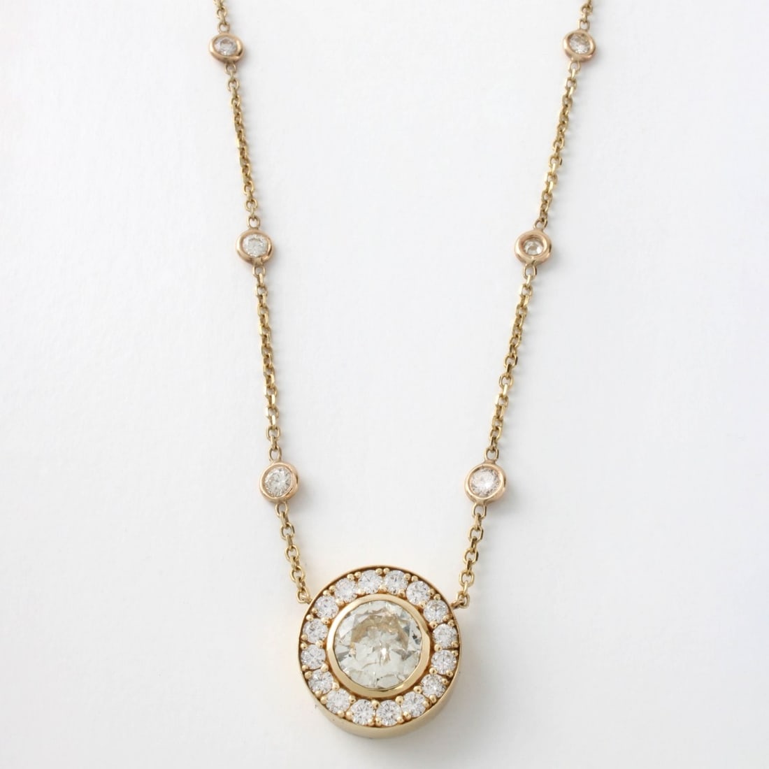 14 K Yellow Gold and Diamond Necklace: 14 Karat Yellow Gold and Diamond Pendant Necklace. The pendant is set in the center with a 2.55 carat round brilliant cut diamond, G-J color, VS-SI clarity. The pendant bezel is set with approx. .92 c