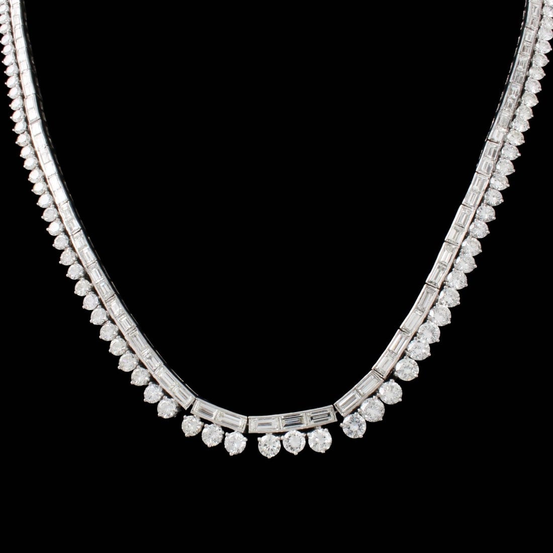 Diamond and 18K Necklace: 18K White Gold and Diamond Necklace. 118 round brilliant cut diamonds 14.95 ctw. G-H in color VS-SI in clarity, 103 baguette cut diamonds 10.40 ctw G-H in color VS-SI in clarity. Total weight 61.27 gr