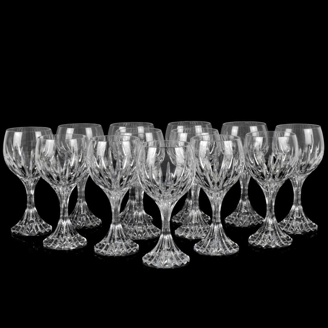 Baccarat "Massena" Cut Crystal Goblets: Thirteen (13) Baccarat "Massena" Cut Crystal Goblets. Each acid etched "BACCARAT FRANCE" to the bottom with etched company logo. The bowl features deep vertical flame cuts on the lower half that trans
