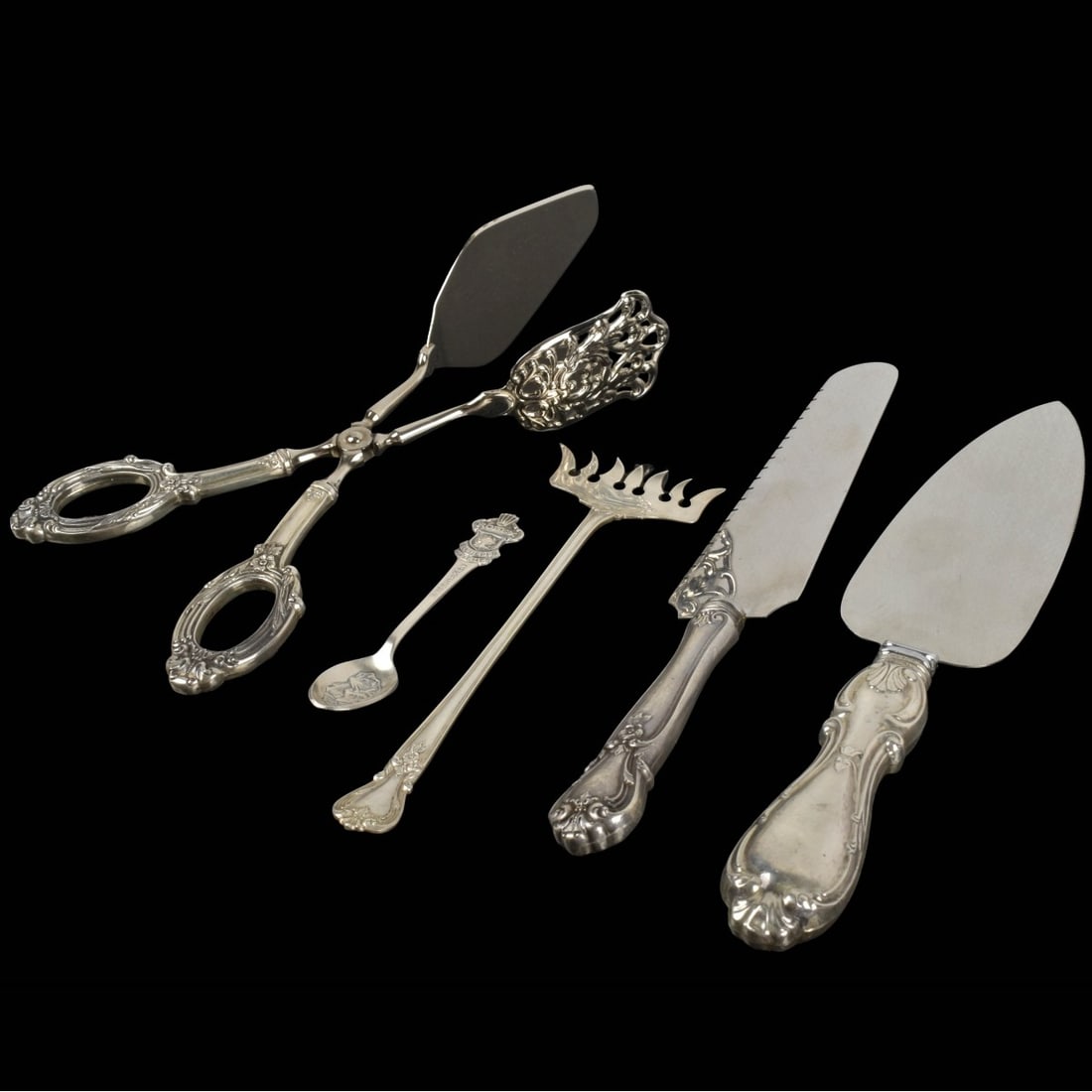 Collection of Silver Pieces: Collection of Five (5) Silver Pieces. Consisting of one (1) seven prong anchovy fork stamped "STERLING" measures: 6-3/4" long, 2" wide, one (1) cake server measures:10-1/4" long with sterling silver h