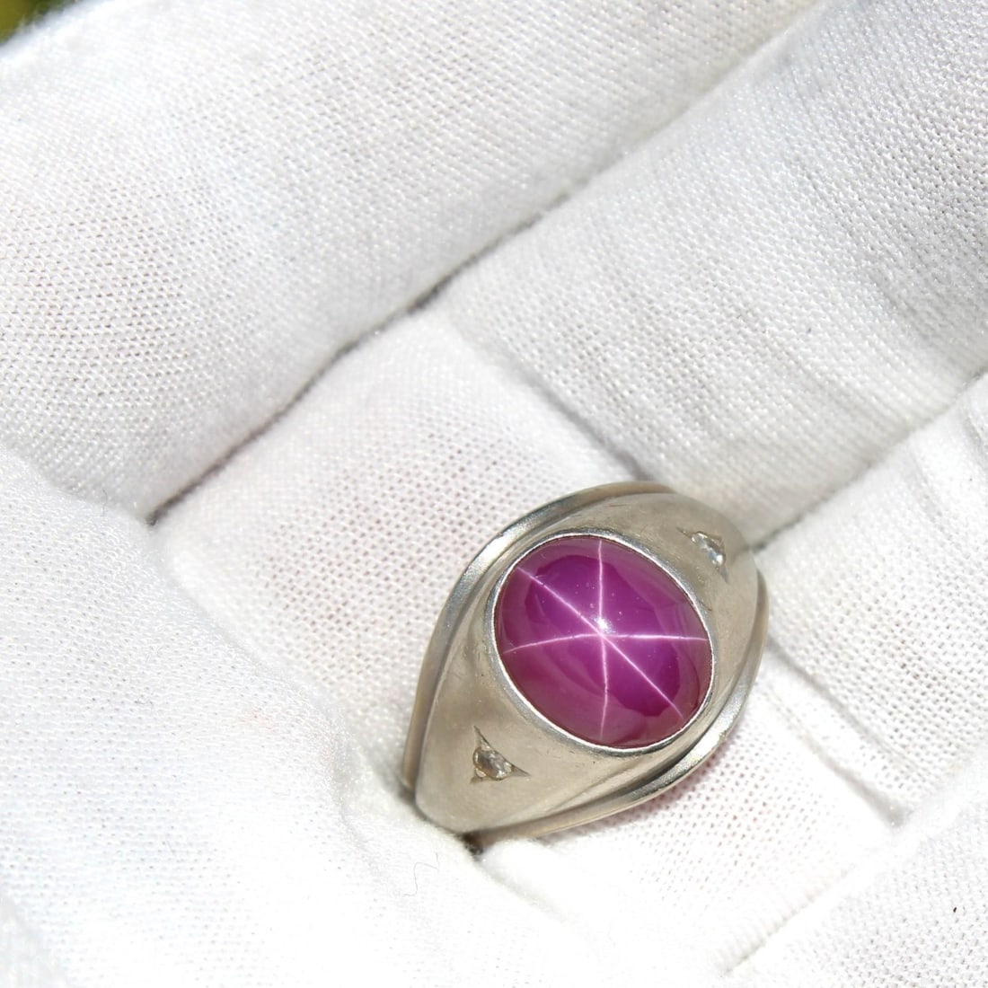 Star Ruby and 14K Ring: Vintage Man Made Star Ruby and 14 Karat White Gold Ring. Stamped 14K. Ring size 7. Approx. weight: 8.20 grams. Kodner Galleries offers phone and absentee bidding at a low, flat 21% buyer?s premium wit