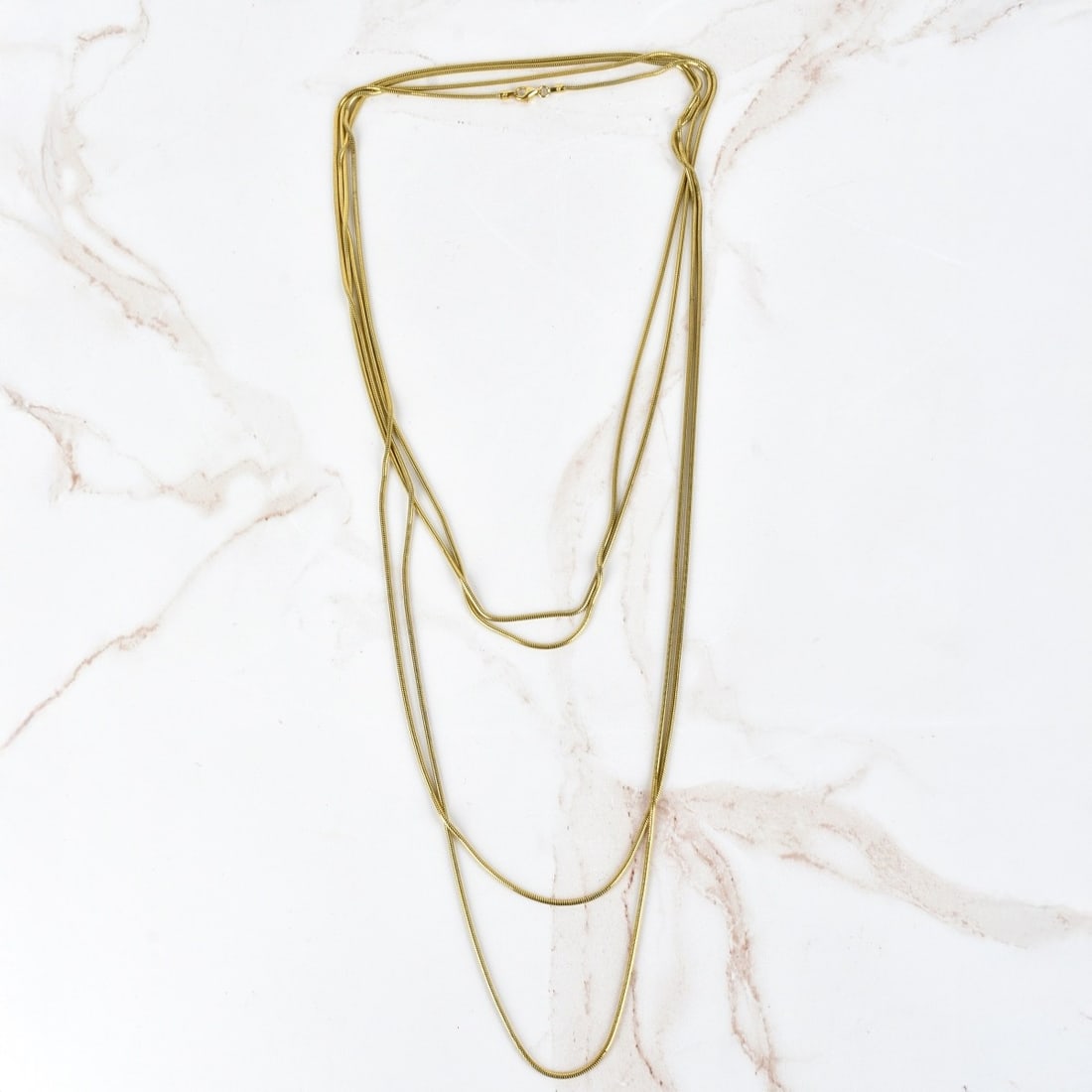 Sterling Silver Vermeil Long Necklace: Vintage 100" L Sterling Silver Vermeil Chain / Necklace. Clasp stamped 925. Approx. weight: 26.78 grams. Kodner Galleries offers phone and absentee bidding at a low, flat 21% buyer?s premium without s