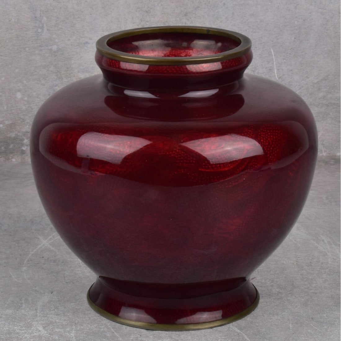 Vintage Japanese Akasuke Cloisonne Vase: Vintage Japanese Akasuke Ginbari Foil Cloisonne Vase with Metal Top and Bottom Mounts. Stamped "JAPAN" to the bottom rim. Measures: 7" H, 7" Dia. Kodner Galleries offers phone and absentee bidding at 