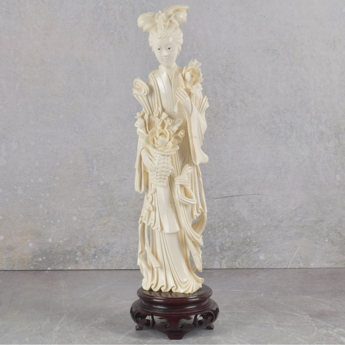 Vintage Carved Japanese Geisha: Vintage Carved Japanese Geisha Girl Sculpture Holding Large Flowers on a Carved Wood Base. Sculpture measures: 10-1/2" high, 2-1/2" wide, 1-3/8" deep, base measures: 1-1/2" high.We Will Not Ship This 