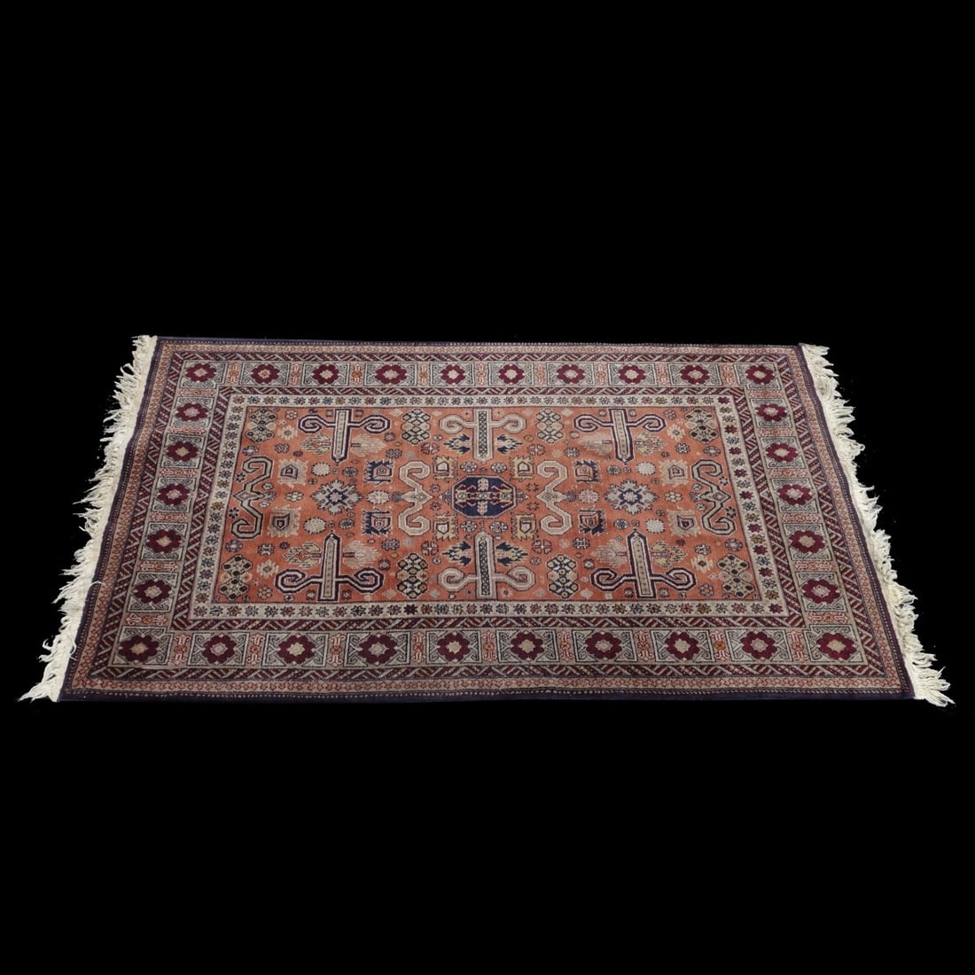 Antique Kazak Tribal Rug: Antique Kazak Tribal Wool Rug. Various patterned designs to the center, intricate patterns on border. Tag attached on obverse side. Measures 74" x 45". Kodner Galleries offers phone and absentee biddi