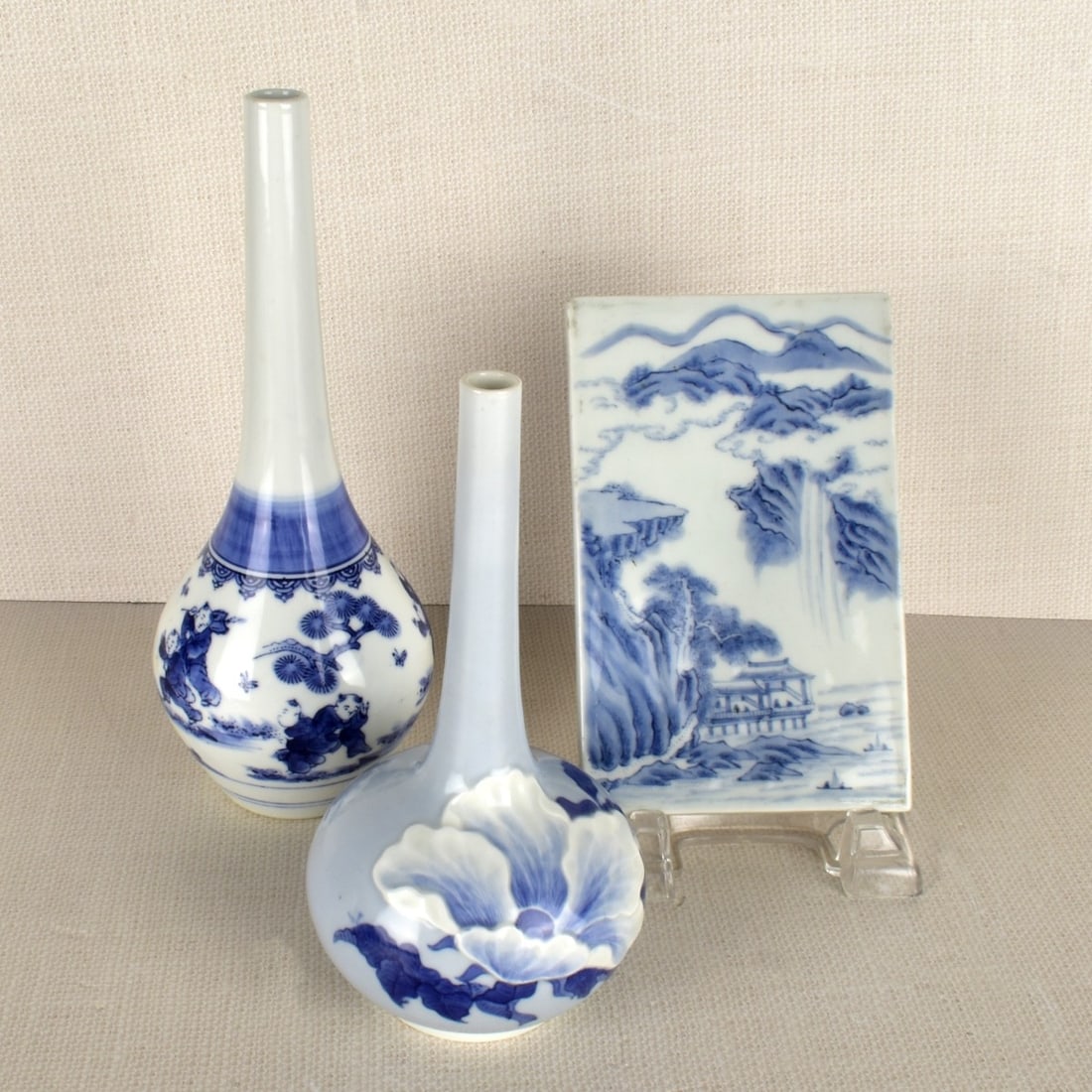 Chinese Articles: Three (3) Chinese Articles Consisting of One (1) Blue and White Bottle Vase Decorated with Lotus Trees and Several People Playing, Artist Signed on the Bottom, Measures: 9-1/2 " H, 4" Dia, One (1) Bot
