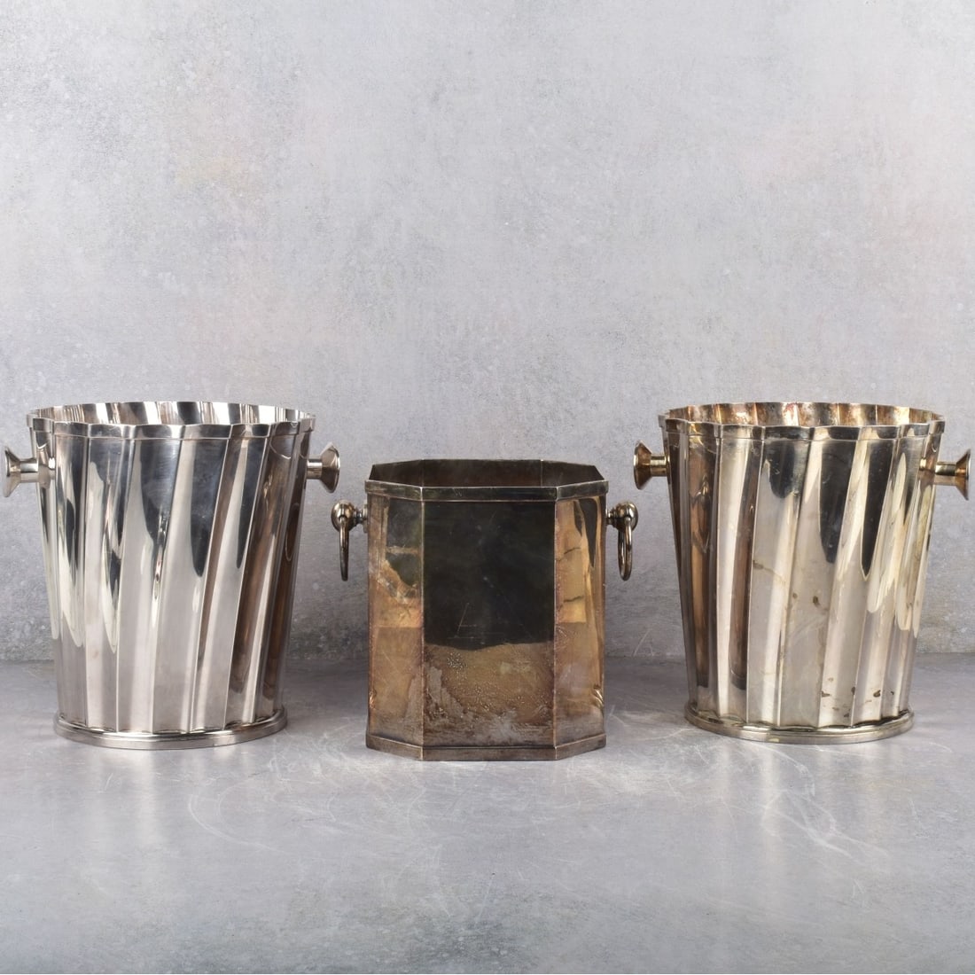 St. James Brazil Silver Plated Champagne Buckets: Three (3) Modernist St. James Brazil Heavy Silverplate Champagne Bucket Wine Coolers. Properly stamped "ST. JAMES BRAZIL." to the bottoms. Two(2) round buckets measure: 8-1/4" high, 7-1/2" diameter, o