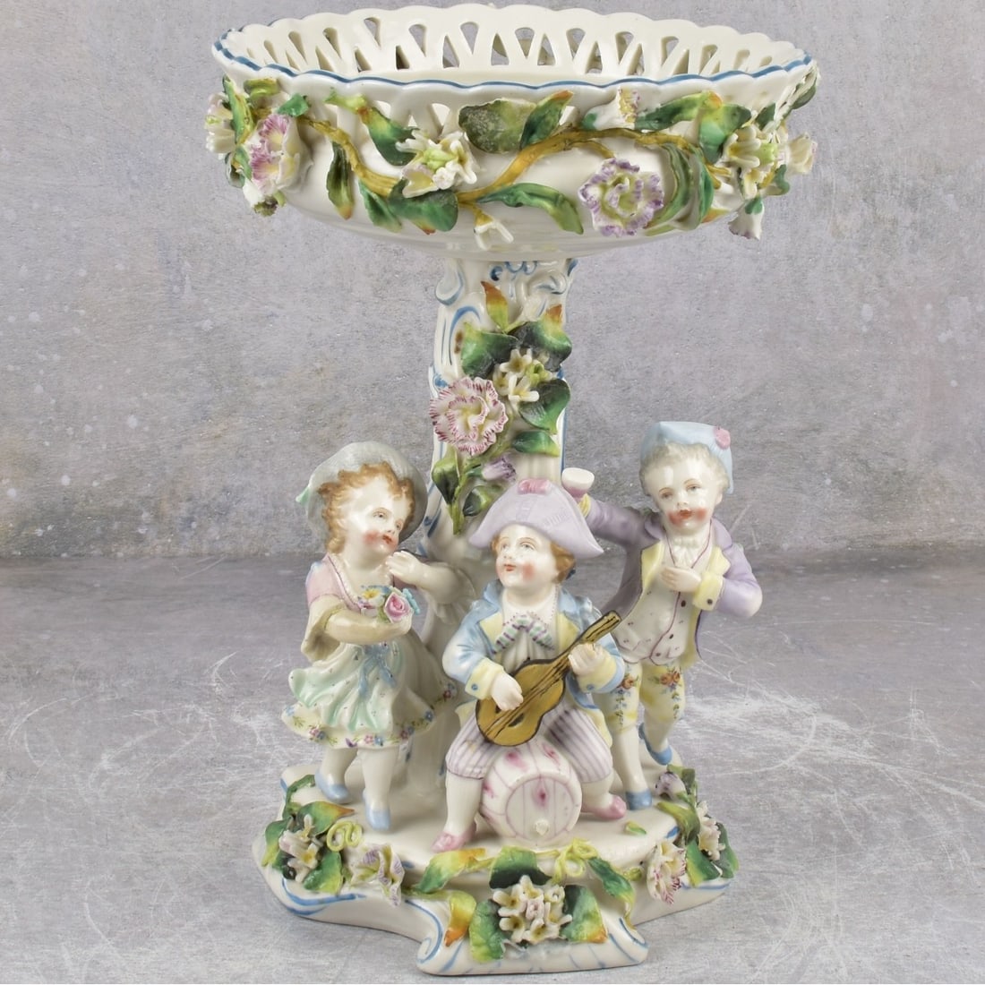 Vintage Figural Porcelain Candy Dish: Vintage Figural Porcelain Standing Centerpiece Candy Dish Bowl with Three (3) Young Children. Measures: 10" high, bowl measures: 6-1/2" diameter. Kodner Galleries offers phone and absentee bidding at 