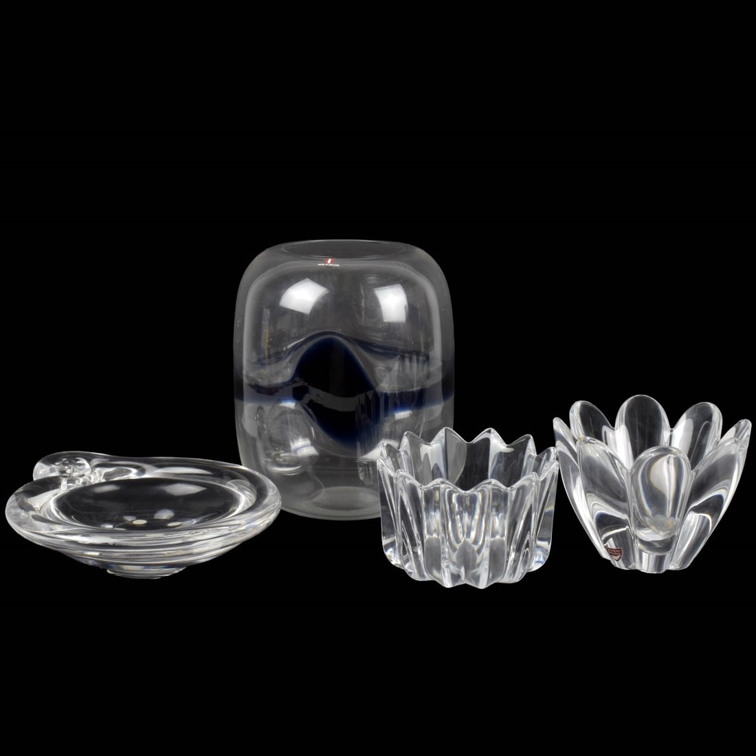 Modern Art Glass Pieces: Four (4) Modern Art Glass Pieces. Consisting of one (1) Timo Sarpaneva, Finnish (1926-2006) clear and blue glass vase, signed, measures: 8" high, 6-1/2" diameter, one (1) Kosta Boda clear swirl dish, 
