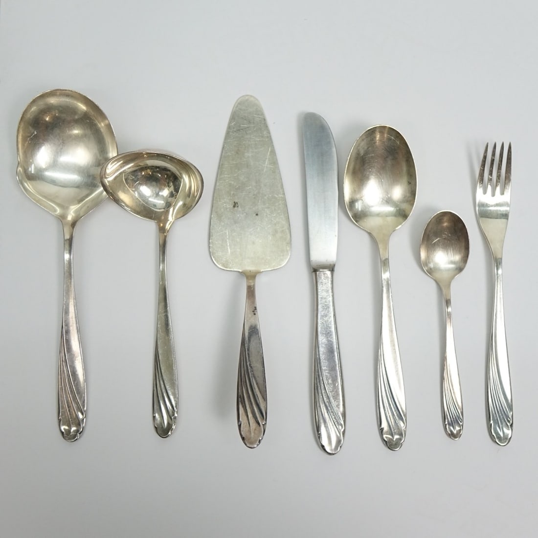 WMF Stainless Vienna (Wein) Flatware: Forty Two (42) Piece WMF "WMF15" Stainless Steel Incomplete Flatware Set. Includes: (8) knives measuring 8-1/4", (16) forks measuring 7-1/4", (8) round bowl soup spoons measuring 7-5/8" x 1-3/4", (7) 