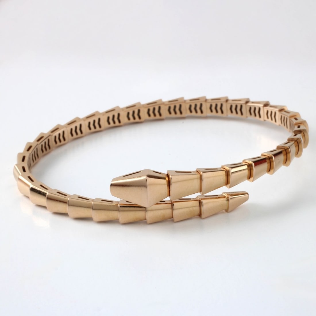 Bulgari 18K Bracelet: Bulgari 18 Karat Pink Gold Serpenti Viper Flexible Cuff Bangle Bracelet. Signed, stamped AU750, Italian hallmark and numbered 7W3EW2. Bulgari size 17, US size 6.7 inches. Approx. weight 21.57 grams.