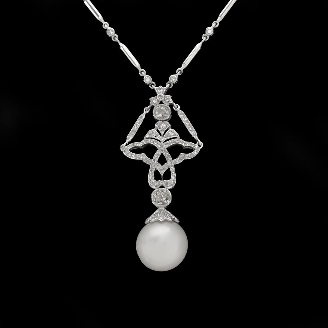 Pearl, Diamond, Platinum and 18K Necklace: Vintage Art Nouveau Design 12.2mm South Sea Pearl, Old European Cut Diamond and Platinum Pendant with 18 Karat White Gold and Round Cut Diamond Delicate "Diamonds by the Yard" Chain. Largest diamonds 