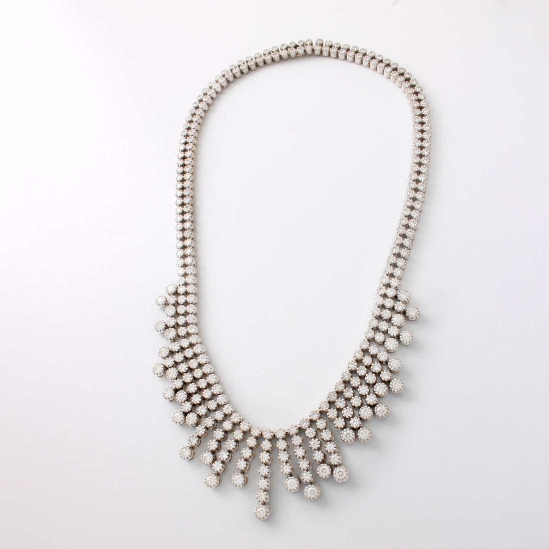 Diamond and 14K Necklace: Vintage Approx. 13.25 Carat TW Round Brilliant Cut Diamond and 14 Karat White Gold Fringe Necklace. Diamonds F-G color, VS1-VS2 clarity. Clasp stamped 14K. Measures 16" L. Approx. weight: 72.58