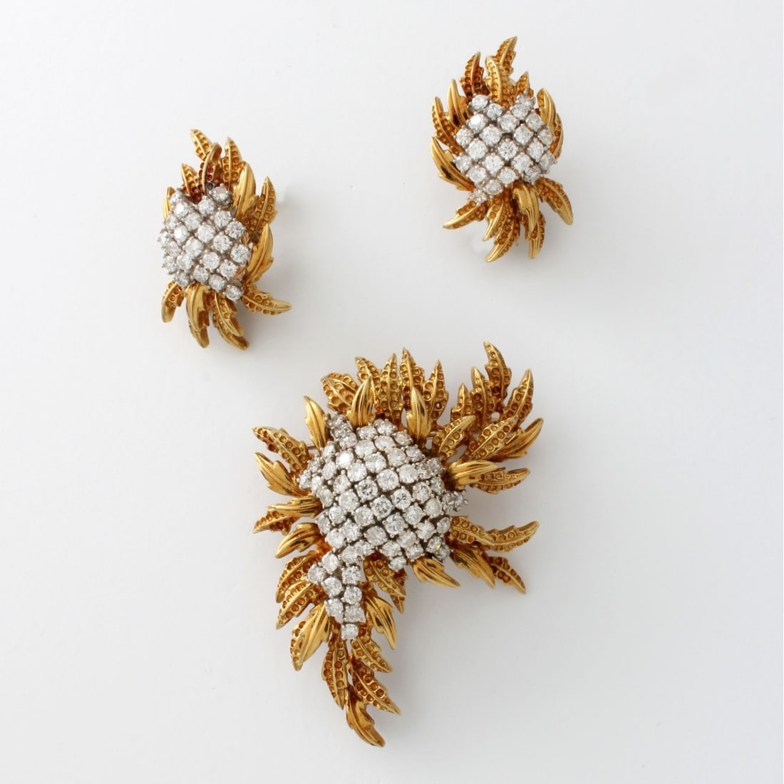 Diamond and 18K Brooch & Earrings: Vintage Approx. 5.75 Carat TW Round Brilliant Cut Diamond, 18 Karat Yellow Gold and Platinum Spray Brooch and Earrings. Diamonds F-G color, VS-SI clarity. Brooch measures 2-1/8" L, 1-5/8" W; earrings 